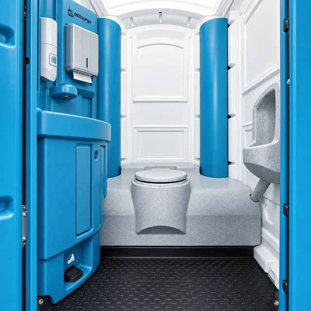 Innenansicht der mobilen Toilette Premium mit Handwaschbecken, Seifen- und Papierhandtuchspender